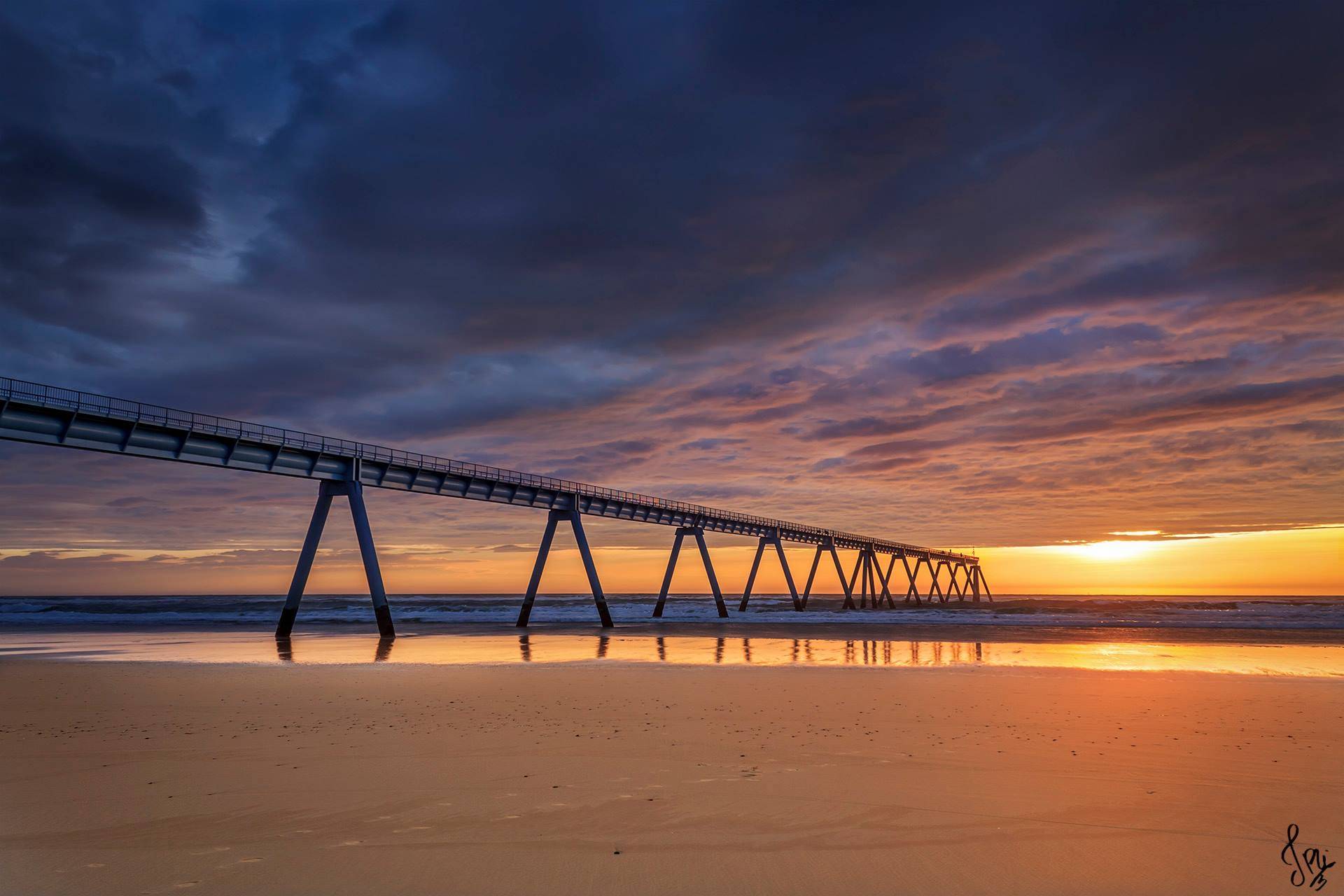 Coucher de soleil au Wharf vu depuis la plage
