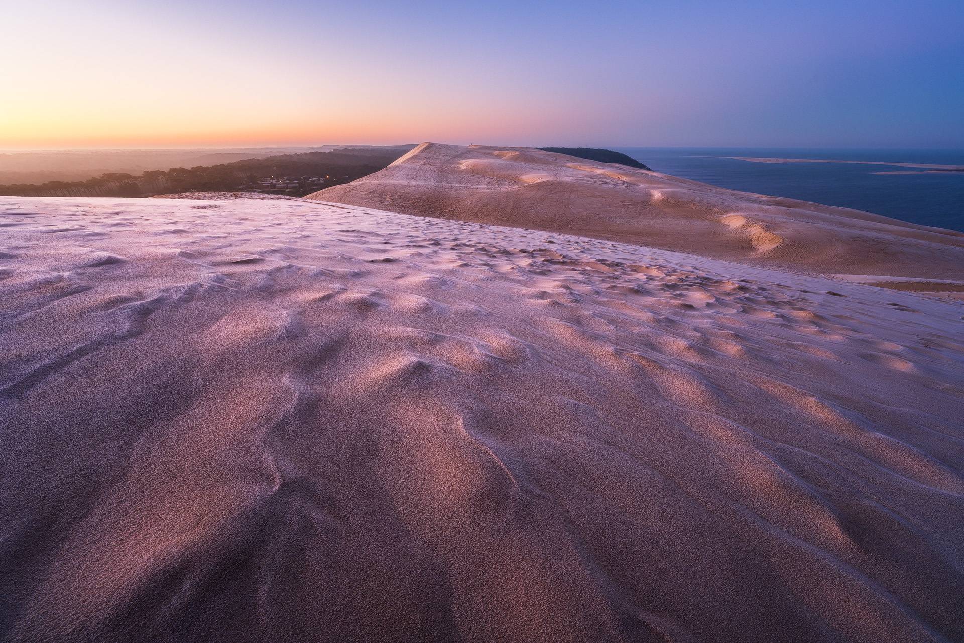 Photo de la dune du pilat gelée au lever du soleil