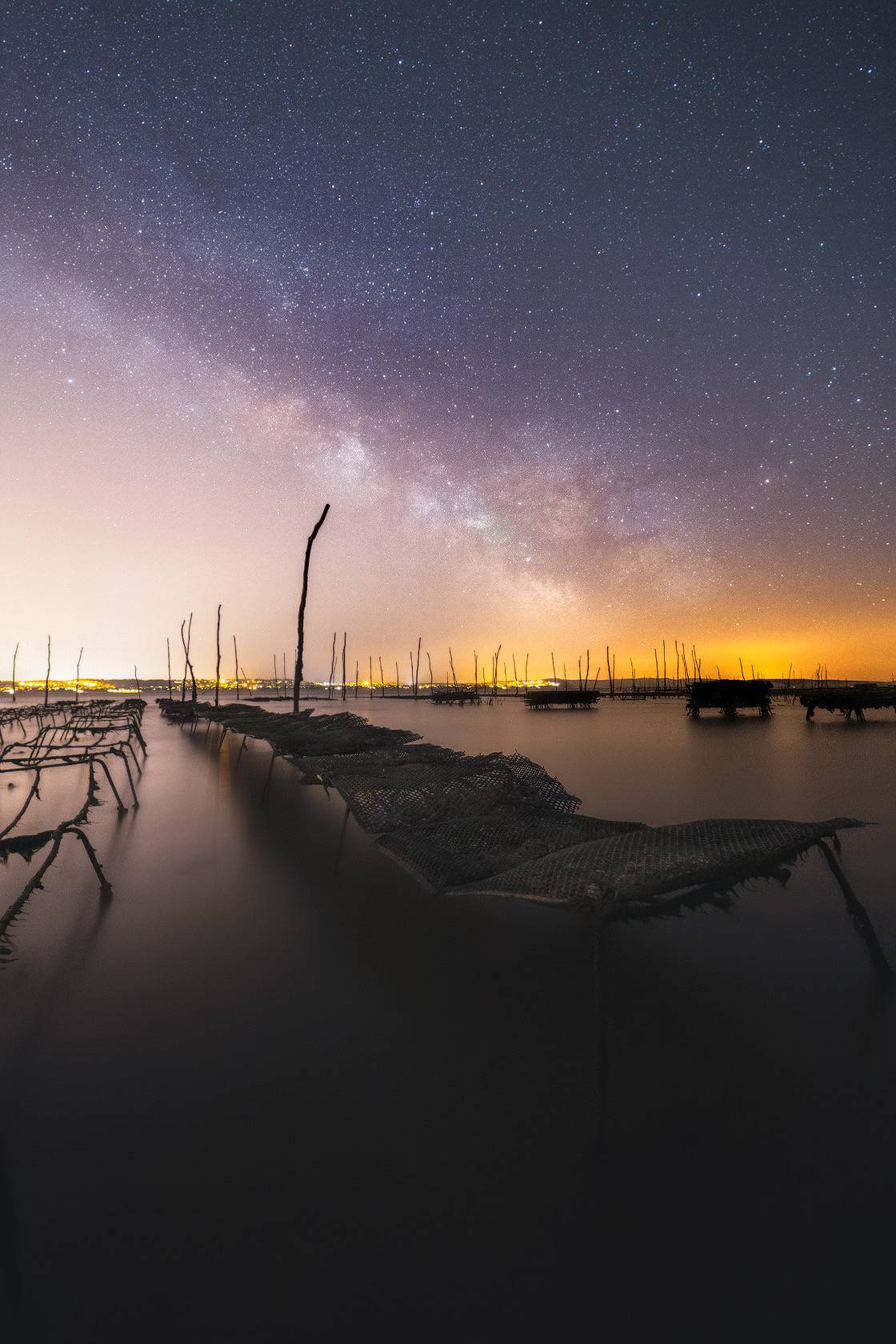 Photo de la voie lactée au dessus des parcs à huitres de la conche du Mimbeau au Cap Ferret